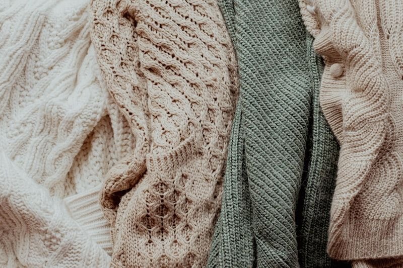 Cable-knit and ribbed sweaters in natural tones