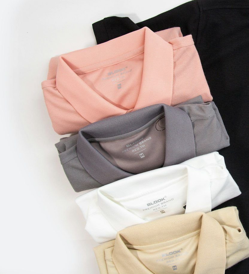 Folded pique polo shirts in several colours