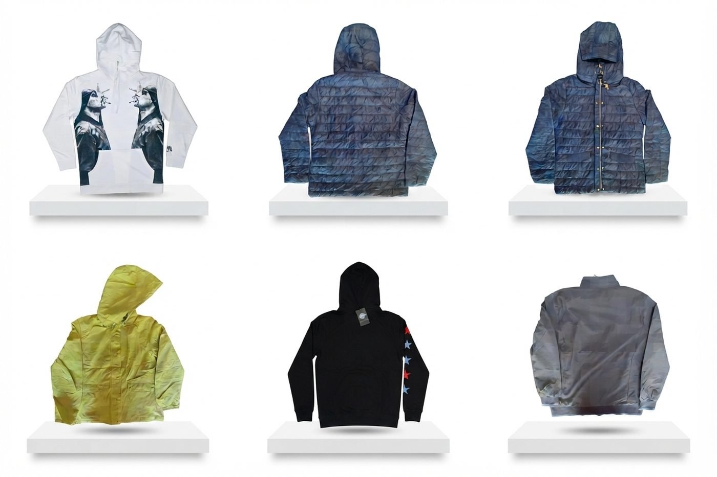 Padded jackets, a lightweight raincoat and hooded tops on display plinths